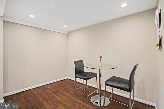 dining space featuring wood finished floors, baseboards, and recessed lighting