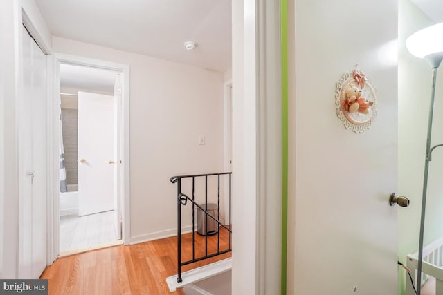 hall featuring wood finished floors