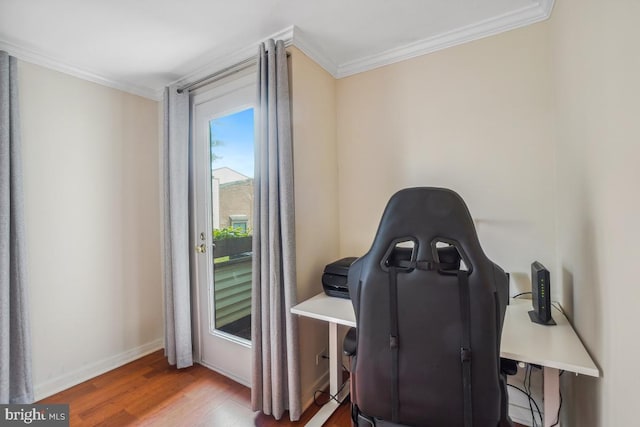 home office featuring ornamental molding, wood finished floors, and baseboards