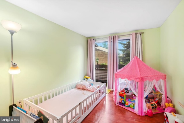 bedroom featuring wood finished floors