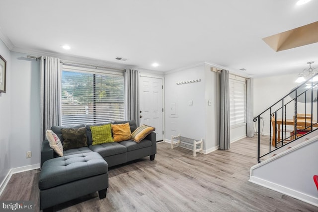 living area featuring crown molding, wood finished floors, stairs, baseboards, and recessed lighting