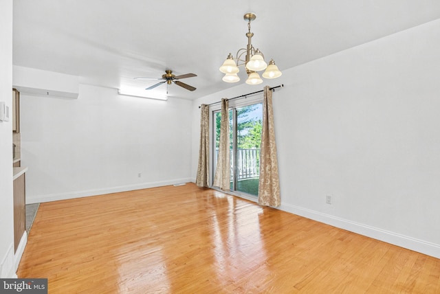643 Saint Anthony Ln, Upper Darby, PA 19082 - empty room with a chandelier, light wood-style floors, baseboards, and ceiling fan