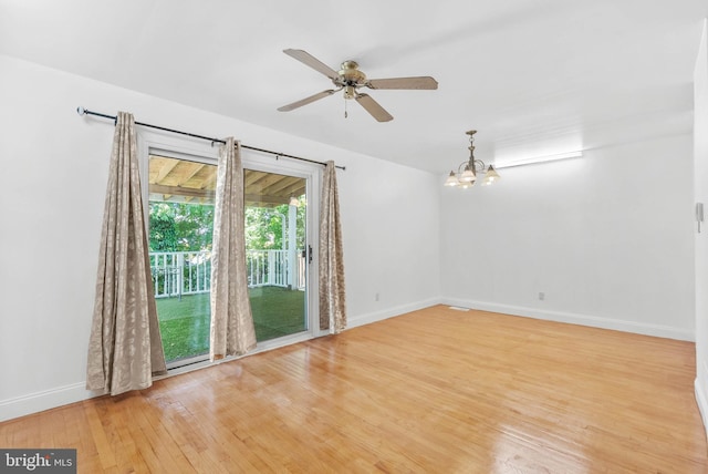 643 Saint Anthony Ln, Upper Darby, PA 19082 - unfurnished room featuring a chandelier, wood finished floors, baseboards, and ceiling fan