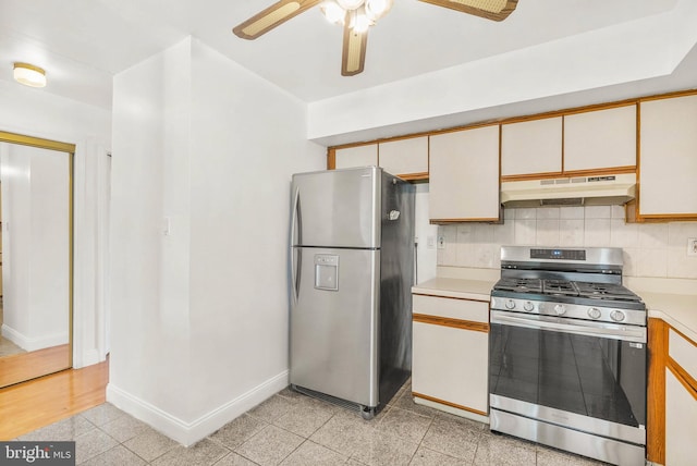 643 Saint Anthony Ln, Upper Darby, PA 19082 - kitchen featuring under cabinet range hood, appliances with stainless steel finishes, light countertops, a ceiling fan, and backsplash