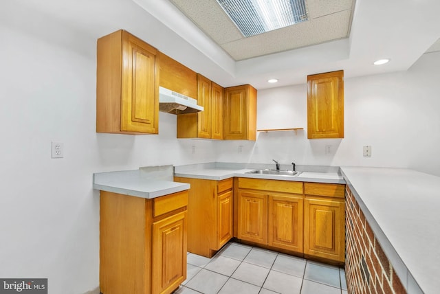 643 Saint Anthony Ln, Upper Darby, PA 19082 - kitchen featuring under cabinet range hood, a sink, brown cabinetry, light countertops, and recessed lighting