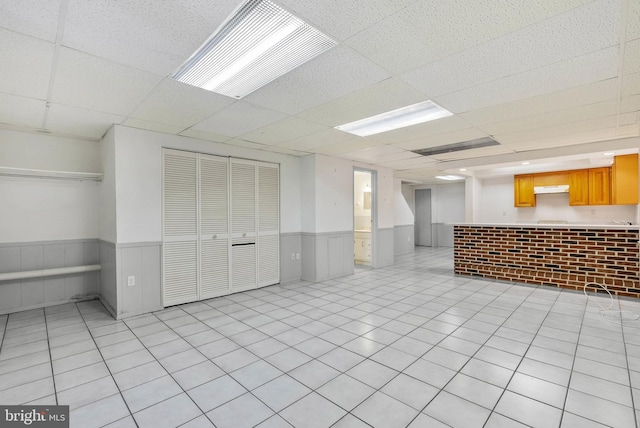 643 Saint Anthony Ln, Upper Darby, PA 19082 - basement with wainscoting and a paneled ceiling