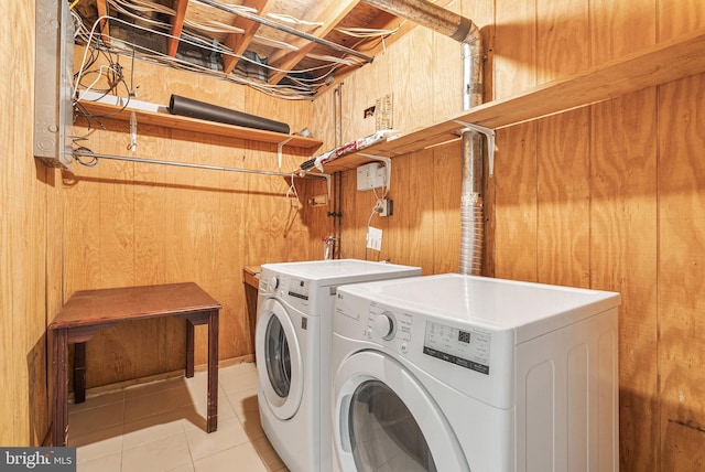 643 Saint Anthony Ln, Upper Darby, PA 19082 - laundry room featuring washer and dryer, wood walls, and light tile patterned floors