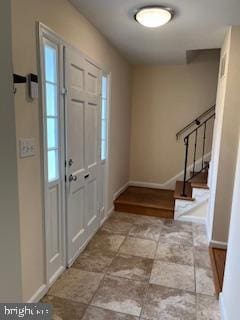 13 E Cliff St, Alexandria, VA 22301 - entryway with stairway, baseboards, and stone finish flooring
