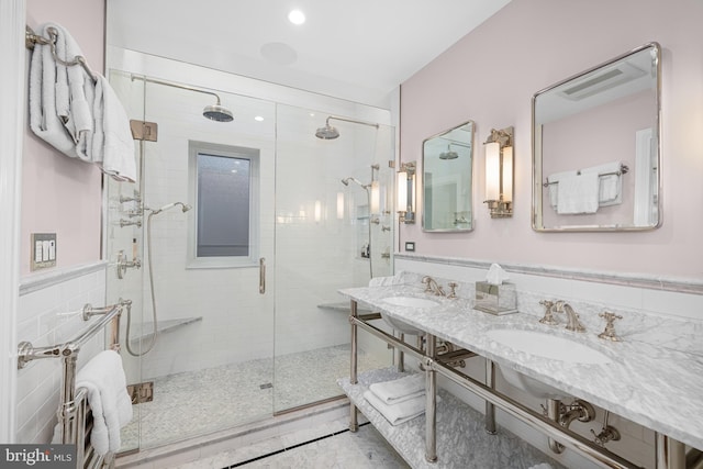 full bathroom featuring a sink and a stall shower