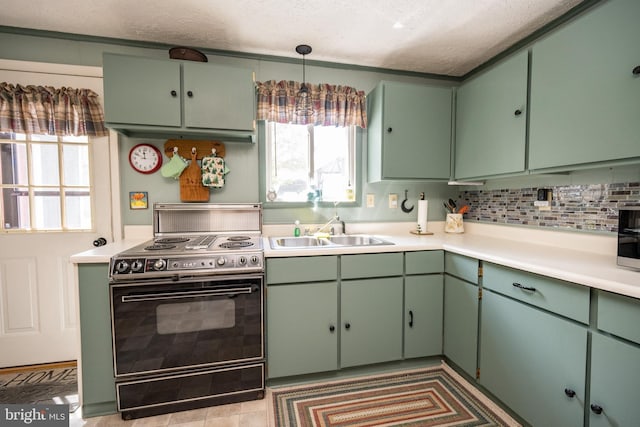 3432 Glendale Rd, Swanton, MD 21561 - kitchen with electric range oven, a sink, light countertops, green cabinets, and a textured ceiling