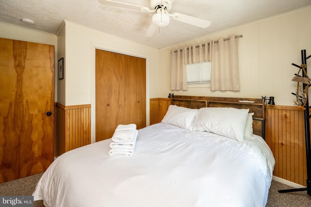 3432 Glendale Rd, Swanton, MD 21561 - bedroom with carpet flooring, a closet, crown molding, a textured ceiling, and a ceiling fan