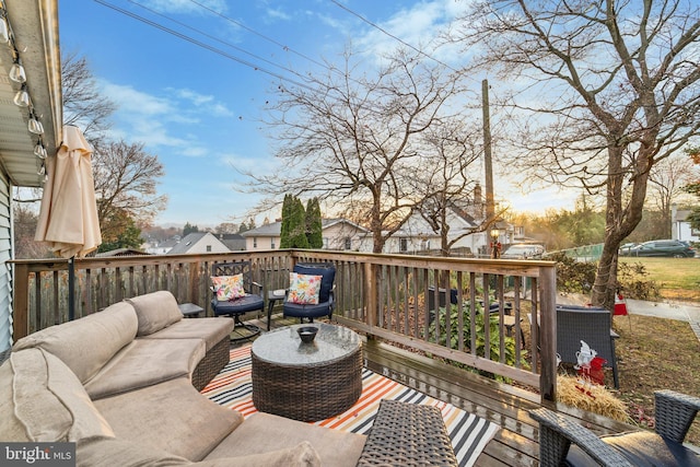 wooden terrace featuring outdoor lounge area