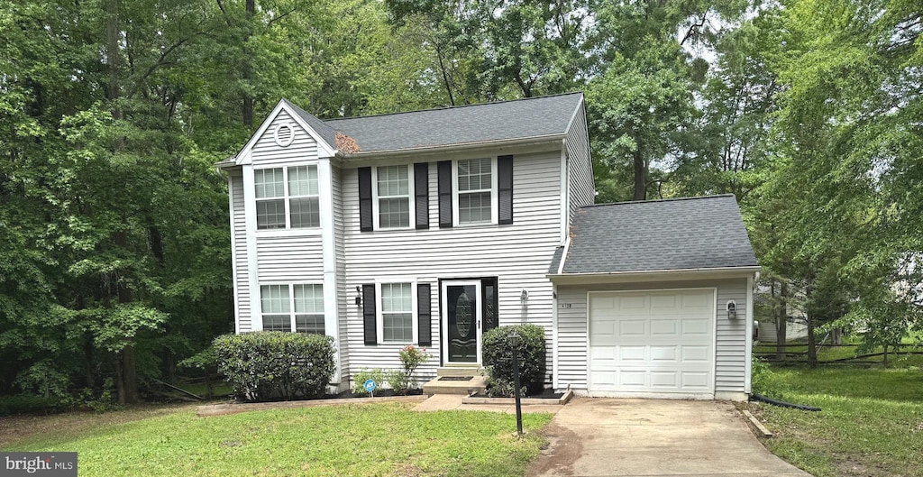 4120 Lancaster Cir, Waldorf, MD 20603 - view of front of house featuring a garage, driveway, a front lawn, and a shingled roof