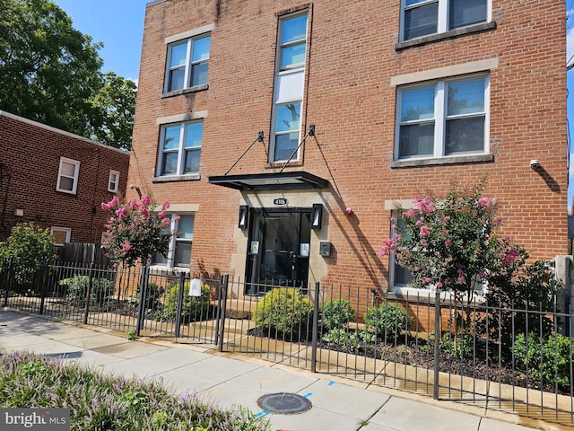 view of property with a fenced front yard