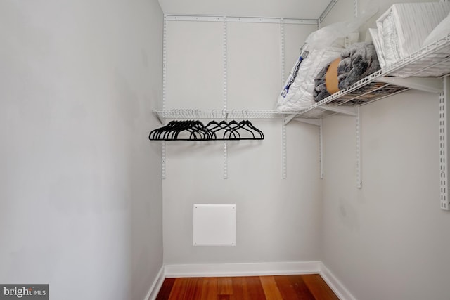 spacious closet with wood finished floors