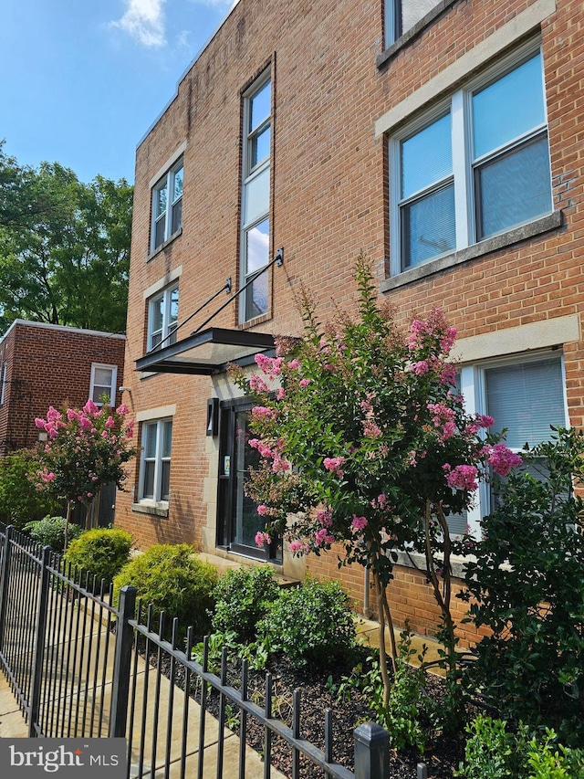 view of building exterior featuring fence