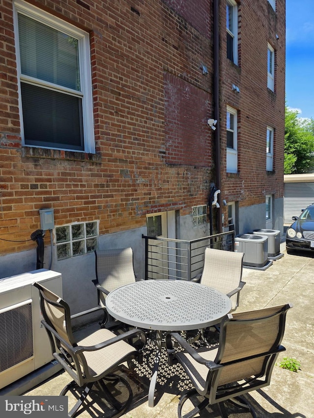 4106 Gault Pl NE Unit 5, Washington, DC 20019 - view of patio featuring central AC, outdoor dining area, and a cooling unit