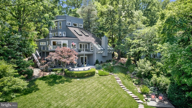 2200 Spinnaker Ct, Reston, VA 20191 - back of property with a patio area, stairs, a yard, a chimney, and a deck