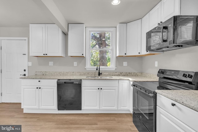 21 Mattingly Ave, Indian Head, MD 20640 - kitchen featuring black appliances, a sink, light stone counters, and recessed lighting