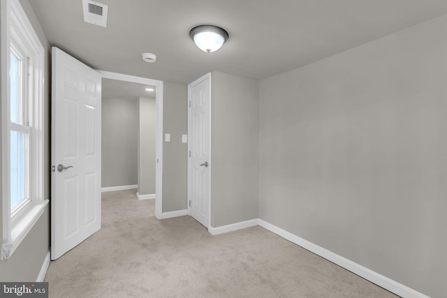 21 Mattingly Ave, Indian Head, MD 20640 - empty room featuring light carpet, baseboards, and a smoke detector