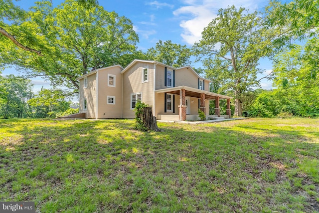 21 Mattingly Ave, Indian Head, MD 20640 - back of house with a lawn and covered porch