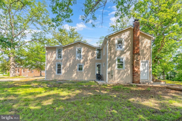 21 Mattingly Ave, Indian Head, MD 20640 - rear view of house with a chimney, entry steps, and a lawn