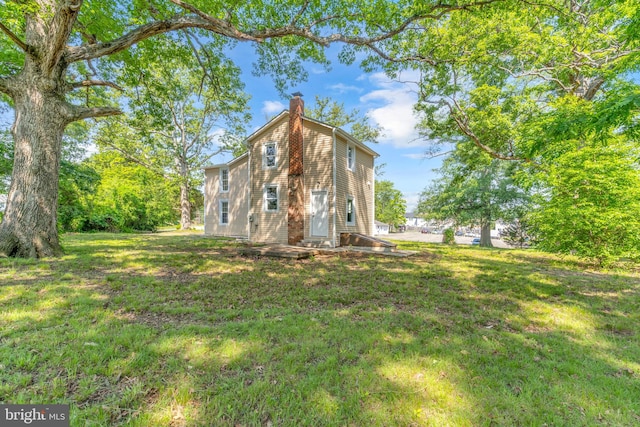 21 Mattingly Ave, Indian Head, MD 20640 - rear view of property featuring a chimney and a yard