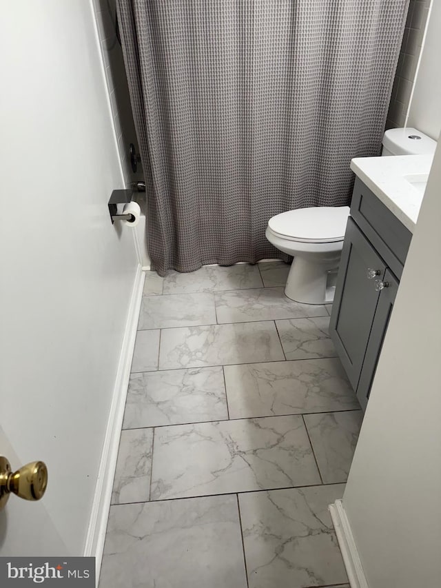 14059 Vista Dr Unit 140, Laurel, MD 20707 - full bathroom with marble finish flooring, vanity, toilet, and baseboards