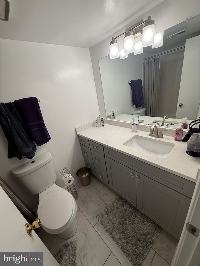 14059 Vista Dr Unit 140, Laurel, MD 20707 - full bath with marble finish floors, toilet, vanity, and a shower with shower curtain