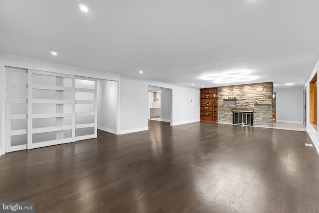 616 Webb Rd, Elkins Park, PA 19027 - unfurnished living room featuring a fireplace, wood finished floors, baseboards, built in shelves, and recessed lighting