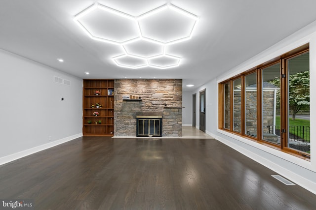 616 Webb Rd, Elkins Park, PA 19027 - unfurnished living room with dark wood-style flooring, a stone fireplace, and baseboards