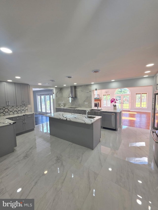 616 Webb Rd, Elkins Park, PA 19027 - kitchen featuring an island with sink, stainless steel dishwasher, gray cabinets, and light marble finish flooring