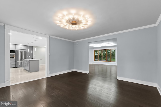 616 Webb Rd, Elkins Park, PA 19027 - unfurnished living room featuring light wood-type flooring, baseboards, crown molding, and a chandelier