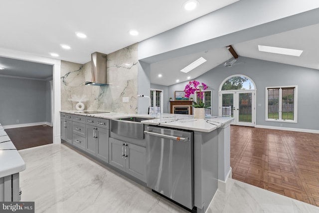 616 Webb Rd, Elkins Park, PA 19027 - kitchen featuring a skylight, dishwasher, wall chimney range hood, gray cabinetry, and open floor plan
