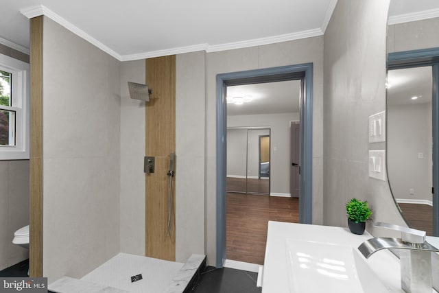 616 Webb Rd, Elkins Park, PA 19027 - bathroom with tiled shower, ornamental molding, toilet, baseboards, and wood finished floors