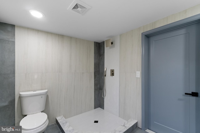 616 Webb Rd, Elkins Park, PA 19027 - full bathroom with a tile shower, toilet, and tile walls