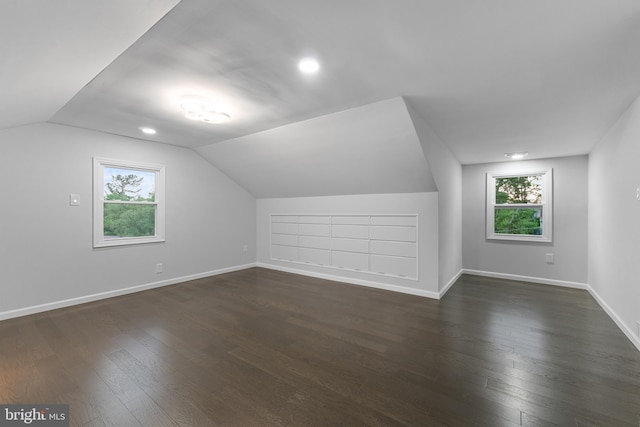 616 Webb Rd, Elkins Park, PA 19027 - bonus room with dark wood finished floors, vaulted ceiling, and baseboards