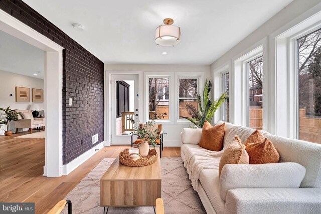 8120 Eastern Ave NW, Washington, DC 20012 - living room featuring brick wall and light wood finished floors