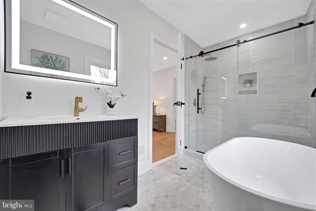 8120 Eastern Ave NW, Washington, DC 20012 - full bath featuring a stall shower, a freestanding tub, recessed lighting, and vanity