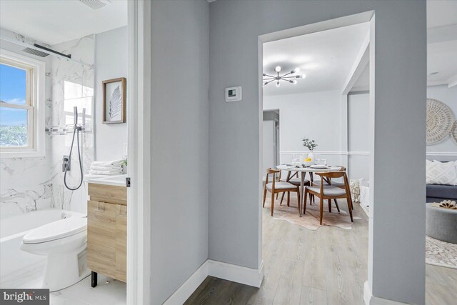1711 Langley Rd, Baltimore, MD 21221 - bathroom featuring wood finished floors and toilet