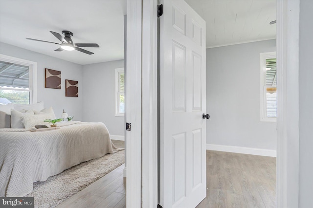 1711 Langley Rd, Baltimore, MD 21221 - bedroom featuring light wood-style flooring, baseboards, and a ceiling fan