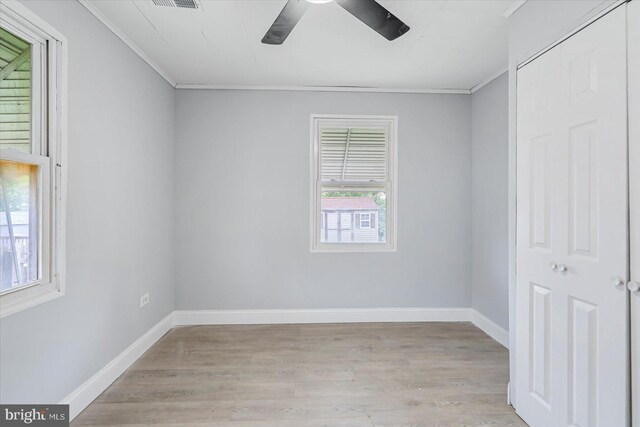 1711 Langley Rd, Baltimore, MD 21221 - spare room with crown molding, light wood-style floors, ceiling fan, and baseboards