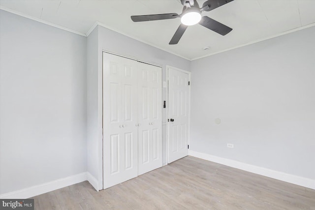 1711 Langley Rd, Baltimore, MD 21221 - unfurnished bedroom featuring crown molding, wood finished floors, a closet, baseboards, and ceiling fan