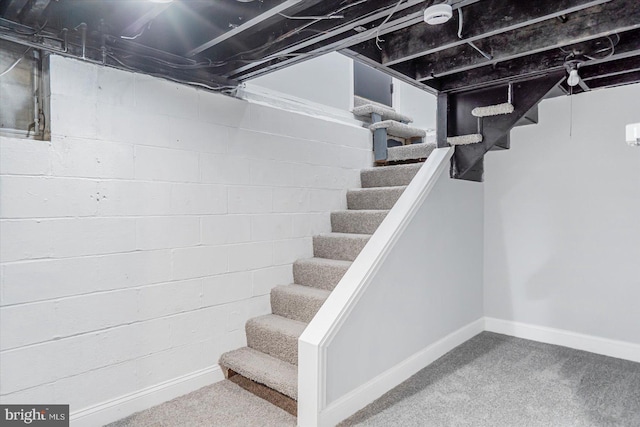 1711 Langley Rd, Baltimore, MD 21221 - below grade area with stairs, baseboards, and carpet
