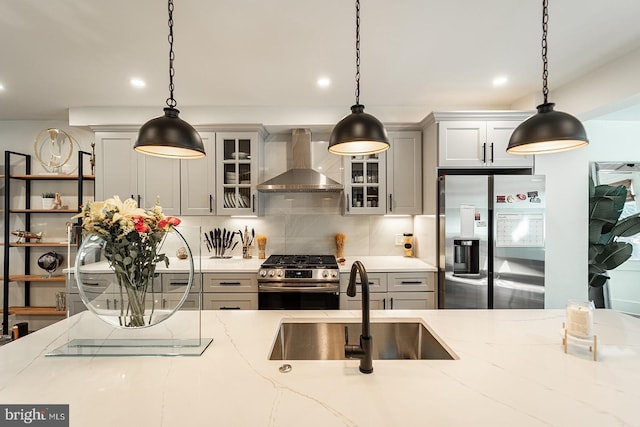 1919 Bennett Pl NE, Washington, DC 20002 - kitchen with wall chimney exhaust hood, stainless steel appliances, a sink, backsplash, and glass insert cabinets
