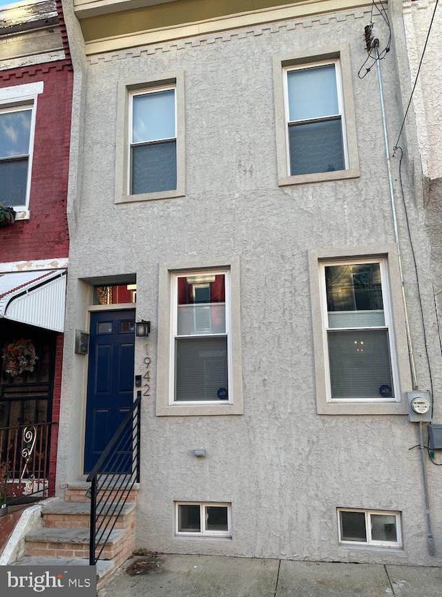 view of property featuring stucco siding