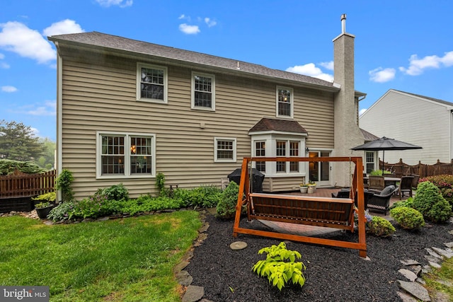 121 Beech Dr, Hatboro, PA 19040 - back of property featuring a chimney, a deck, and a patio area