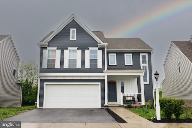 1722 Bradley Dr, Harrisburg, PA 17110 - view of front of home with driveway, a garage, covered porch, and board and batten siding
