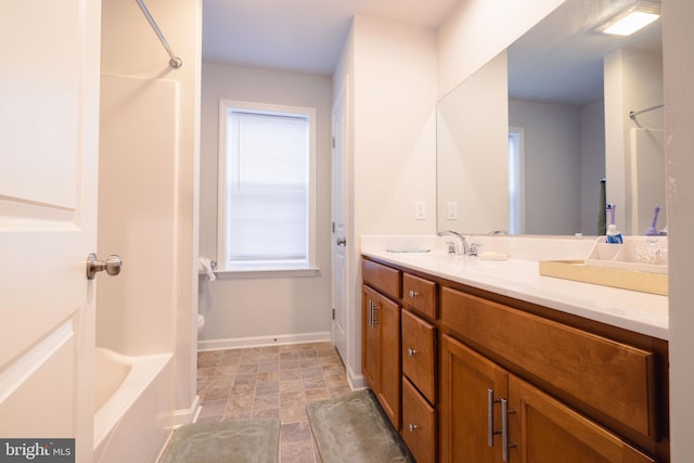 1722 Bradley Dr, Harrisburg, PA 17110 - full bathroom featuring vanity, baseboards, toilet, and stone finish flooring