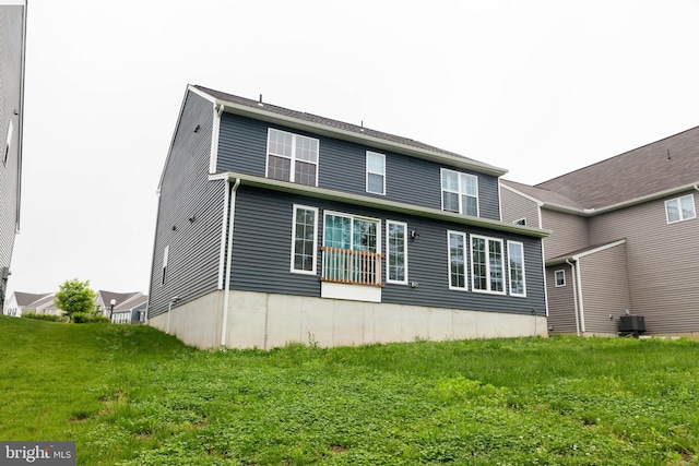 1722 Bradley Dr, Harrisburg, PA 17110 - back of property featuring central AC and a lawn